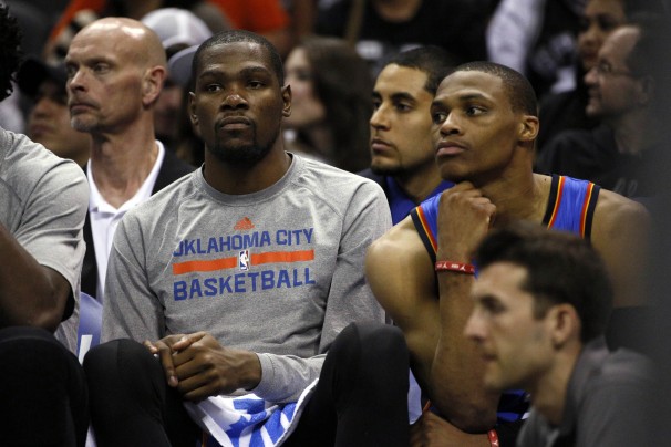 Kevin Durant and Russell Westbrook watch from the bench in a blowout loss in game 2 against the San Antonio Spurs. 
Courtesy: Soobum Im/Usa Today Sports