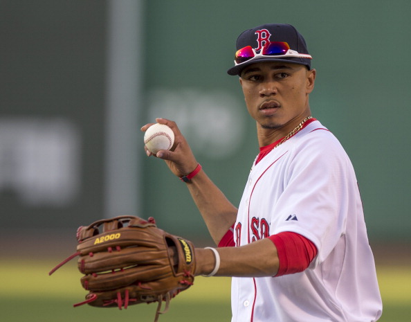 BOSTON, MA - JUNE 30:  Mookie Betts #50 of the Boston Red Sox warms up before a game against the Chicago Cubs at Fenway Park on June 30, 2014 in Boston, Massachusetts. (Photo by Michael Ivins/Boston Red Sox/Getty Images)