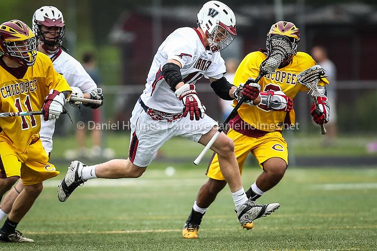 (5/27/14, WESTBOROUGH, MA) Westboroughs Jake Srebnik leaps down field during the boys lacrosse tournament game against Chicopee at Westborough High School. 
Courtesy: Daily News and Wicked Local Photo/Dan Holmes