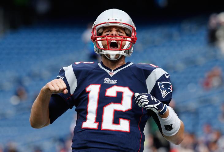 FOXBORO, MA - OCTOBER 26:  Tom Brady #12 of the New England Patriots reacts before a game against the Chicago Bears at Gillette Stadium on October 26, 2014 in Foxboro, Massachusetts.  (Photo by Jim Rogash/Getty Images)