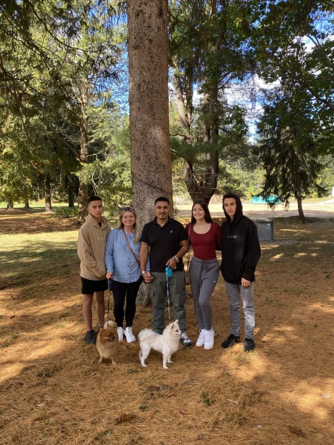 Pictured here is Daphnne Cabrera 23 with her family and two dogs:  Luka and GiGi.