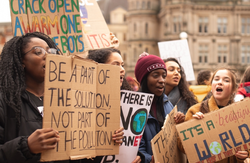 Group of young adults protesting against climate change (Source: unep.org)