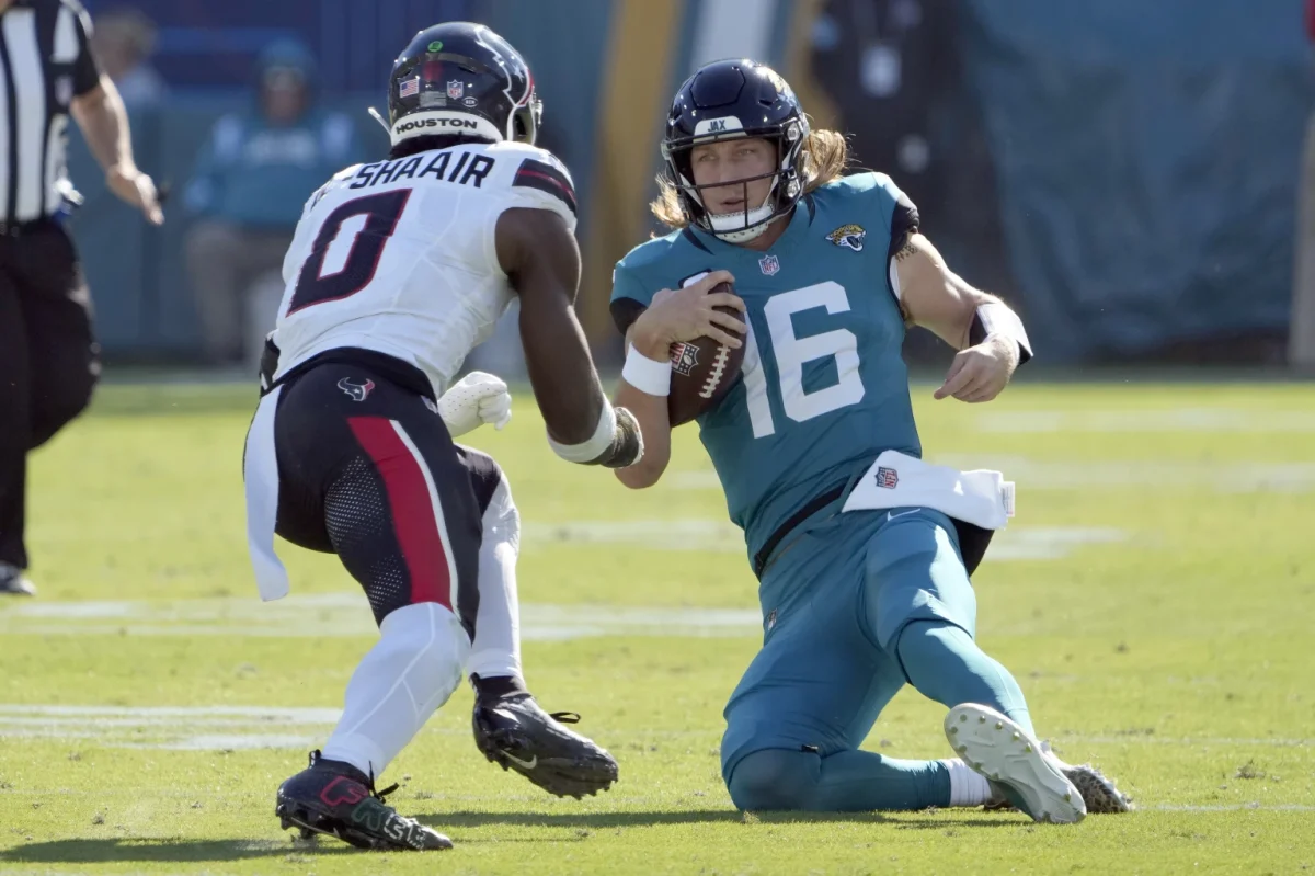 Image of  Texans Linebacker Azeez Al-Shaair going in for the hit on Trevor Lawrence mid slide (Source: apnews.com)