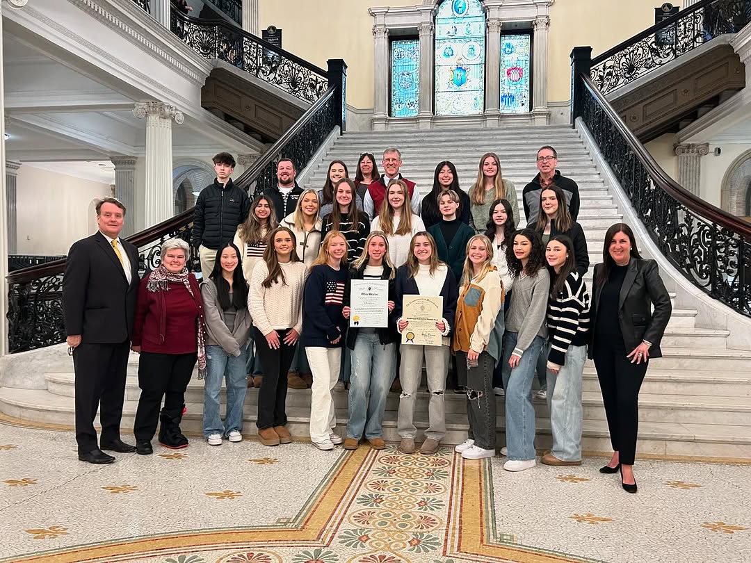 Image of the WHS Girls' Volleyball posing on the Grand Staircase at the Statehouse. (Source: Westborough Athletics)